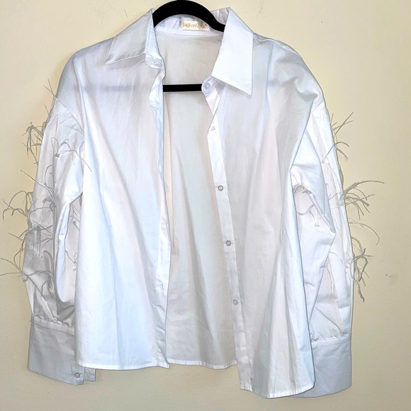 Tops - White button down blouse with feathers.